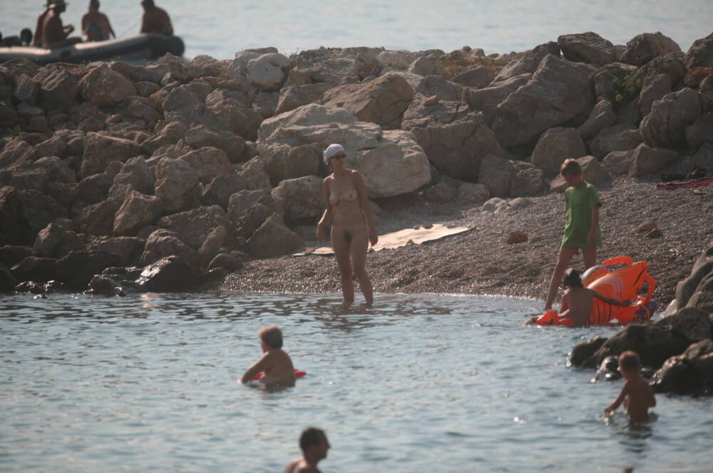 FKK cove pyramid in waters - Naturism promotes openness toward the body
