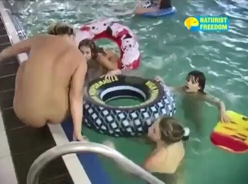 Naturist Freedom Full Pool - Blending in with the crowd of nudists